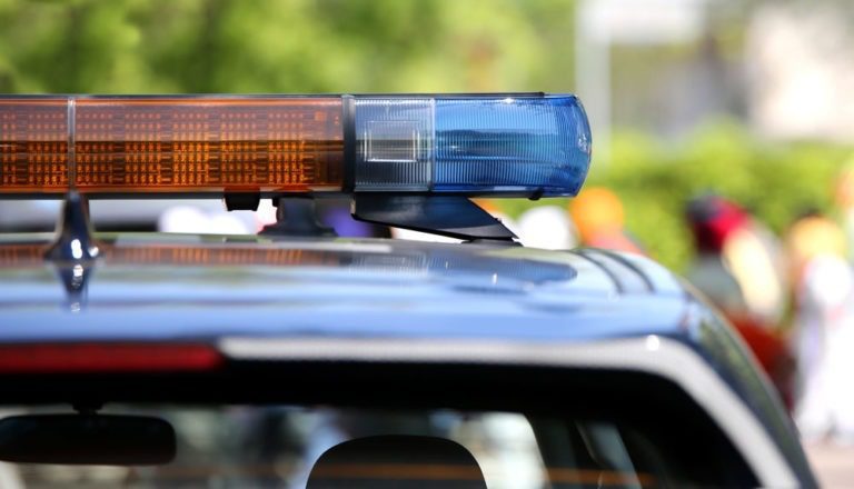 Close-up of lights on the top of a police car.